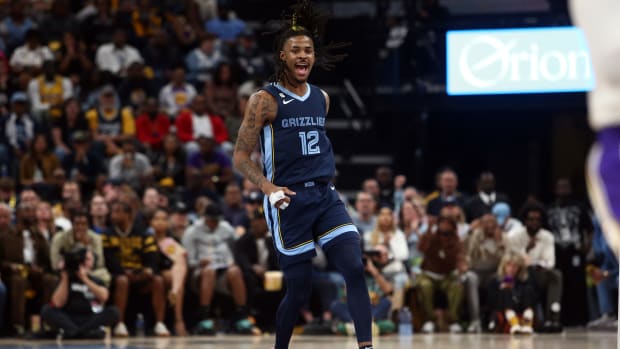 Memphis Grizzlies guard Ja Morant reacts after a play.